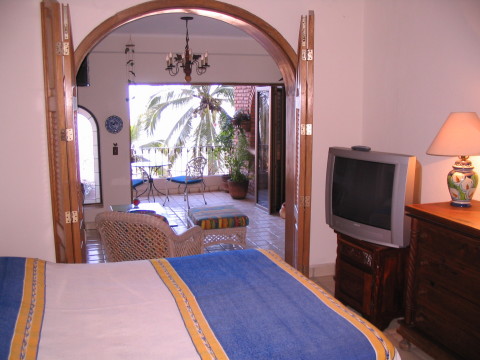 view through bedroom and livingroom to terrace and the bay